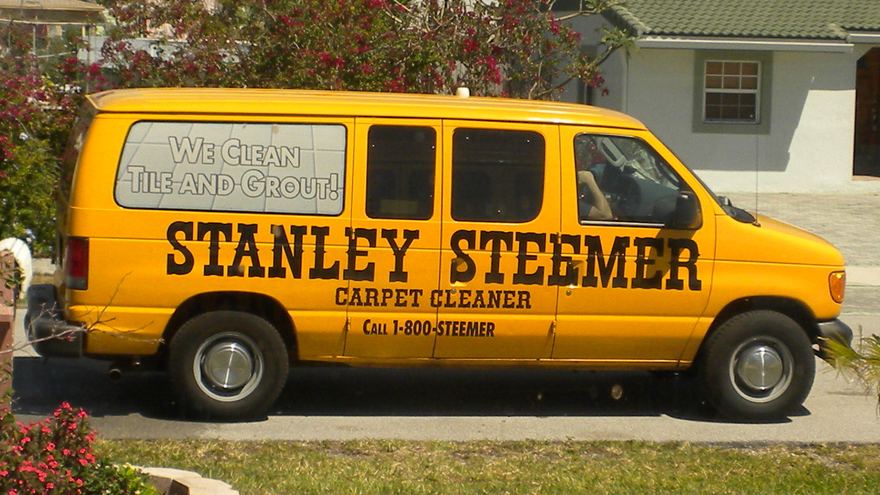 Stanley Steemer van with Call 1-800-STEEMER painted on the side